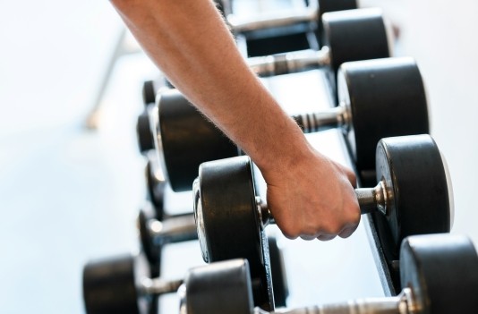 Image of athlete using weights